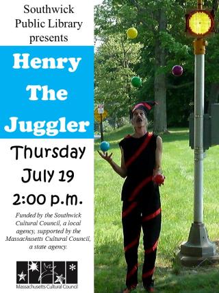 IMAGE OF HENRY IN A JESTER COSTUME JUGGLING OUTSIDE BY A LAMP POST