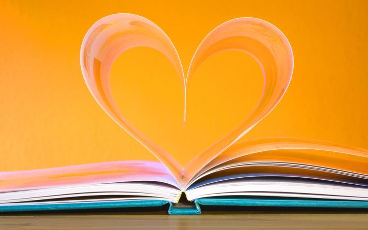 Book pages in the shape of a heart. 